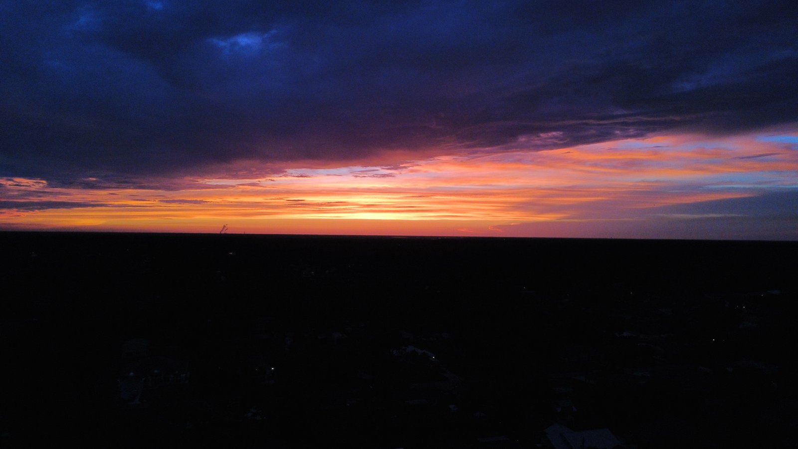 Vivid orange and blue sunset over the Space Coast